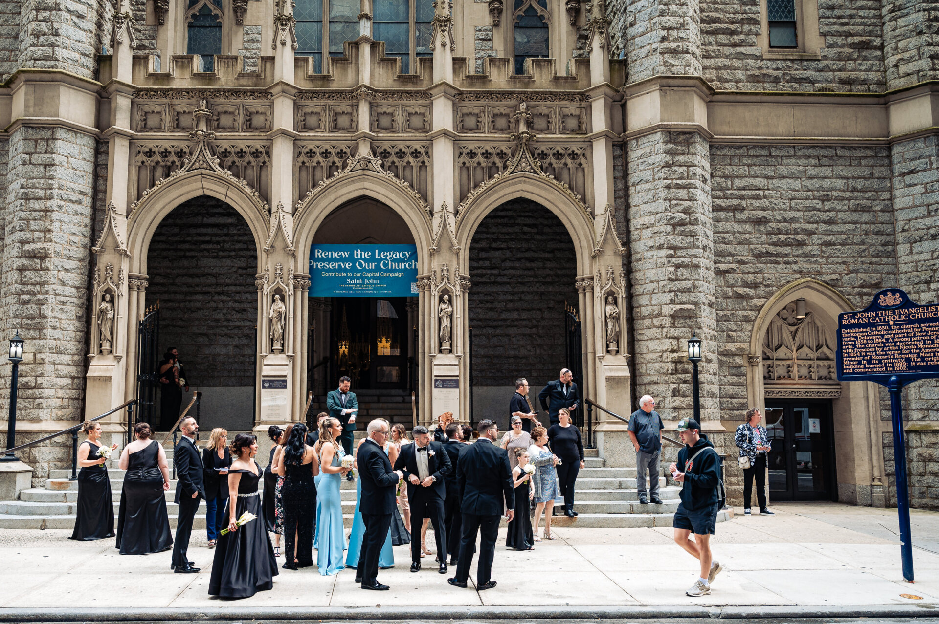 Guests standing outside the church waiting for the bride to arrive