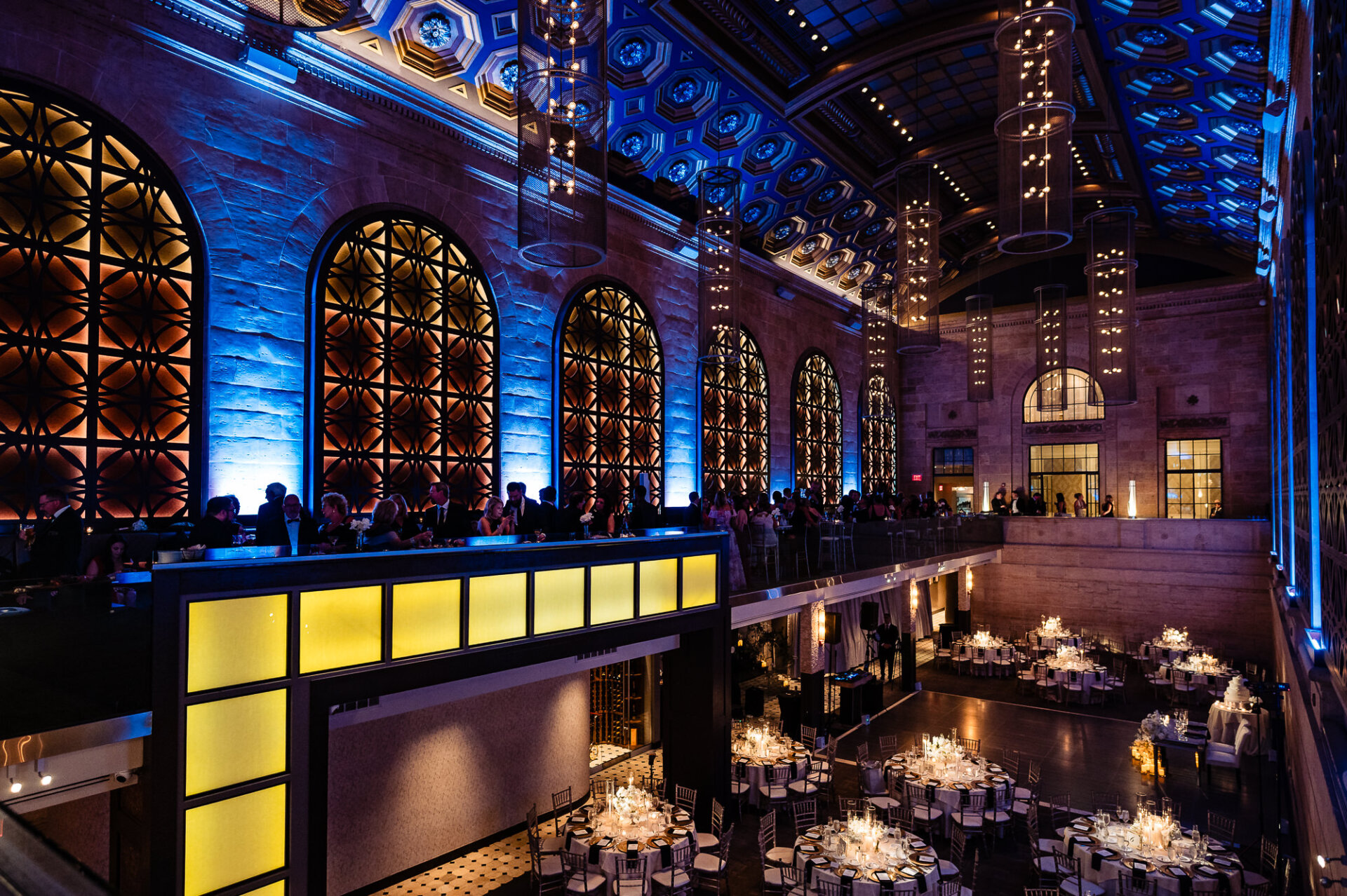 Dramatic Union Trust reception space with blue lighting and long tables