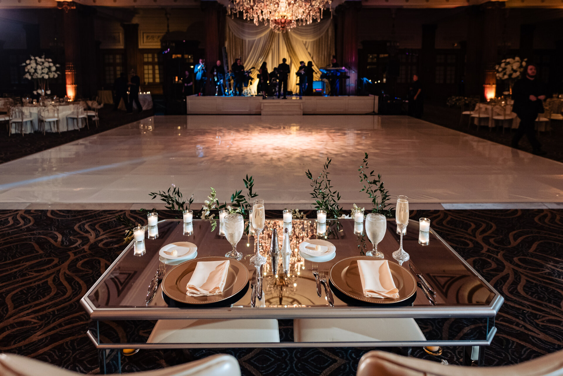 The wedding ceremony setup showing the beautifully decorated chuppah or wedding canopy as the centerpiece.