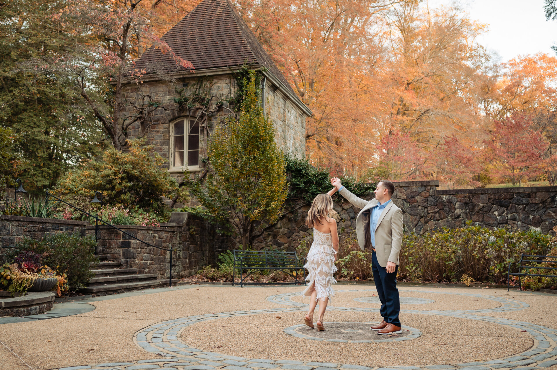 Couple dancing together in a circular stone courtyard