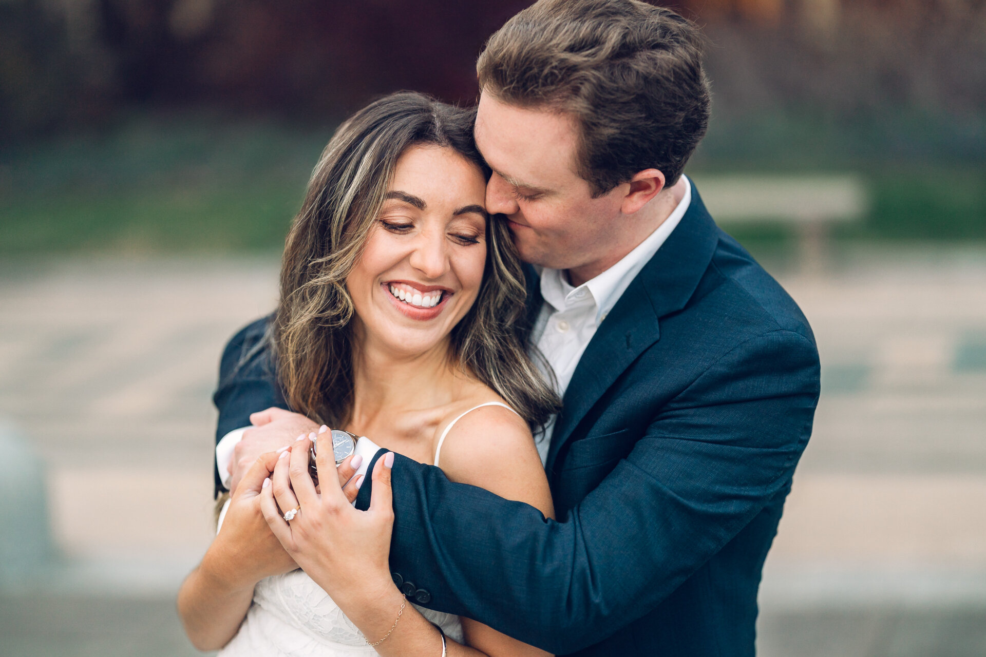 Couple sharing a close embrace during their Philadelphia Waterworks engagement session.