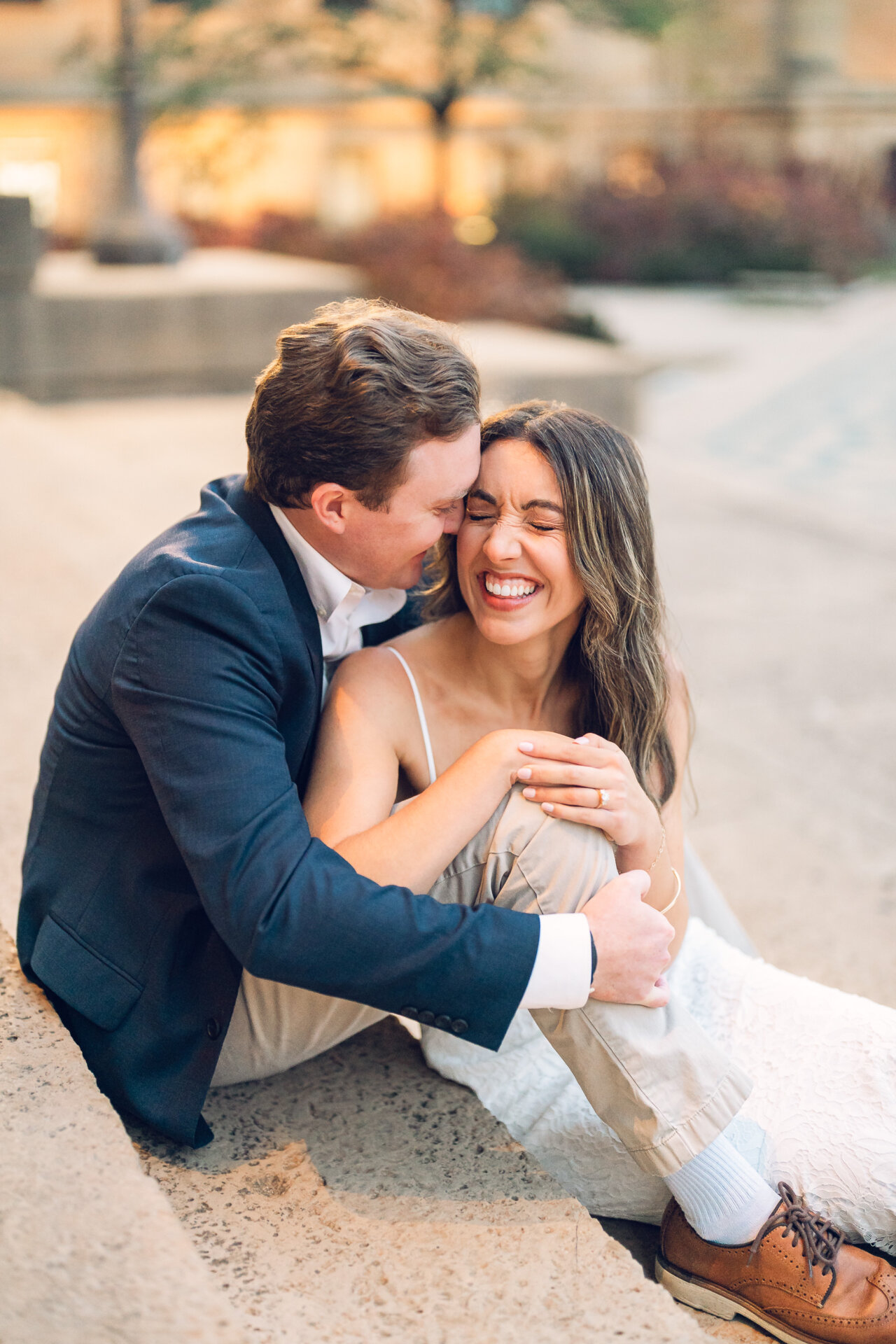 Couple sharing a close embrace during their Philadelphia Waterworks engagement session.