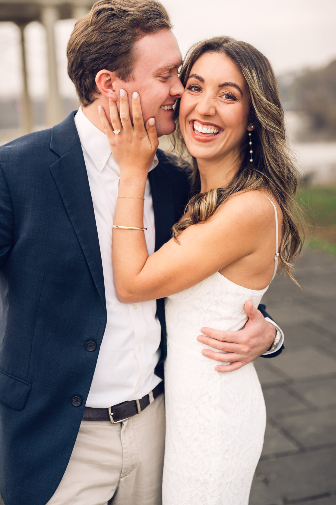 Couple sharing a close embrace during their Philadelphia Waterworks engagement session.