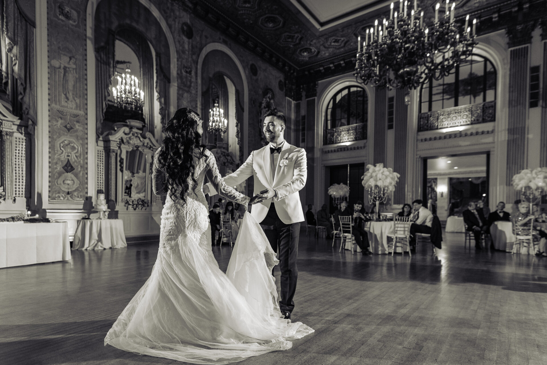 Black and white image of the bride and groom dancing together in the Hotel DuPont ballroom during the reception.