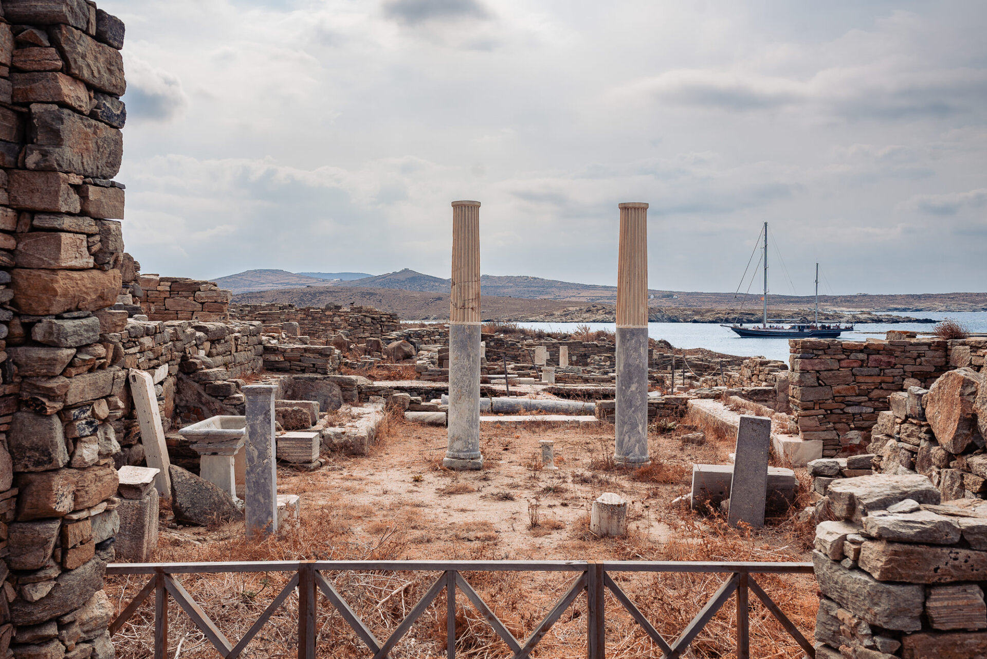 ancient archaeological ruins on Delos Island, Greece, overlooking the Aegean Sea