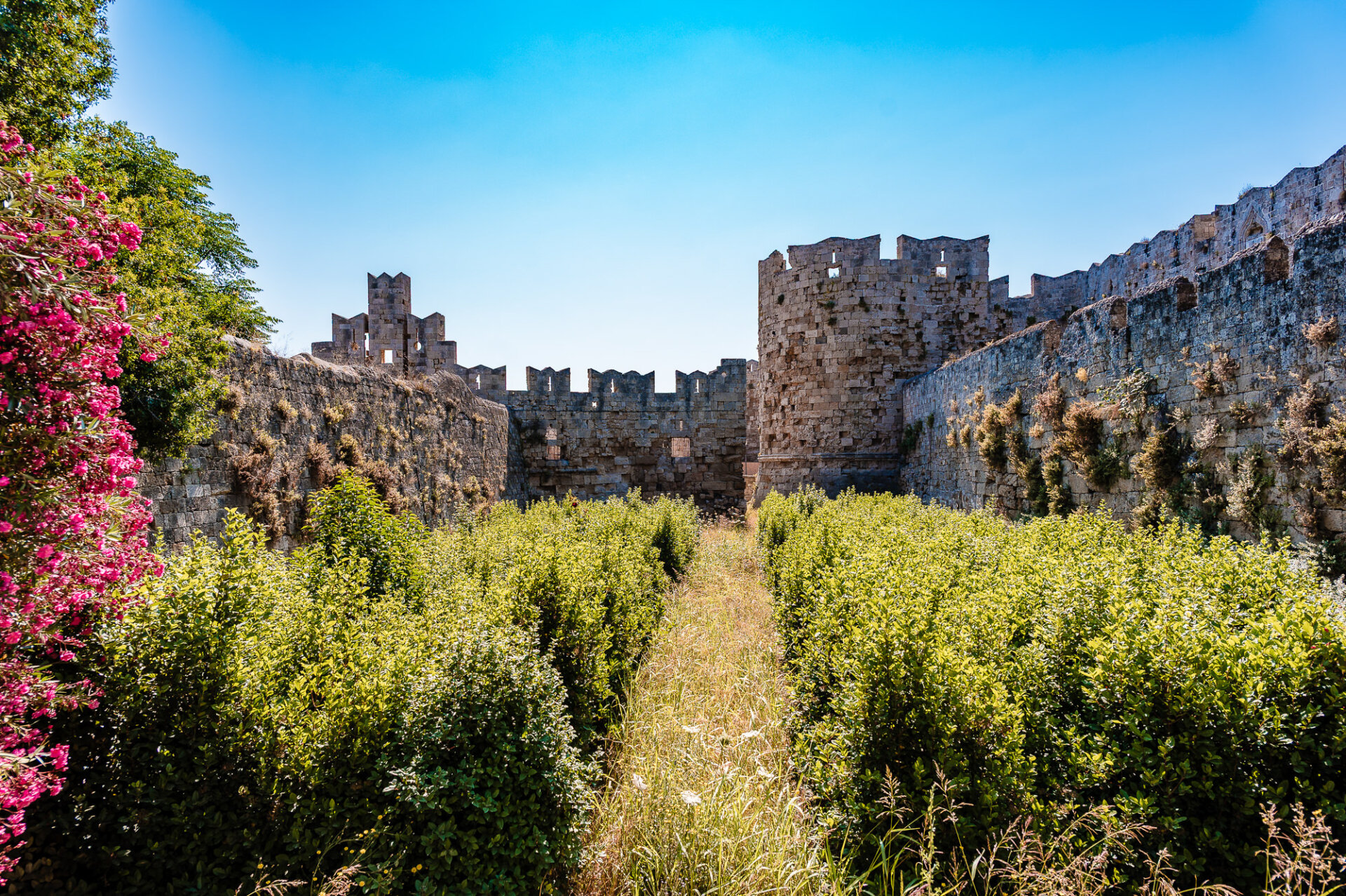 a portion of the Medieval City of Rhodes, specifically the historic dry moat area between the city walls.