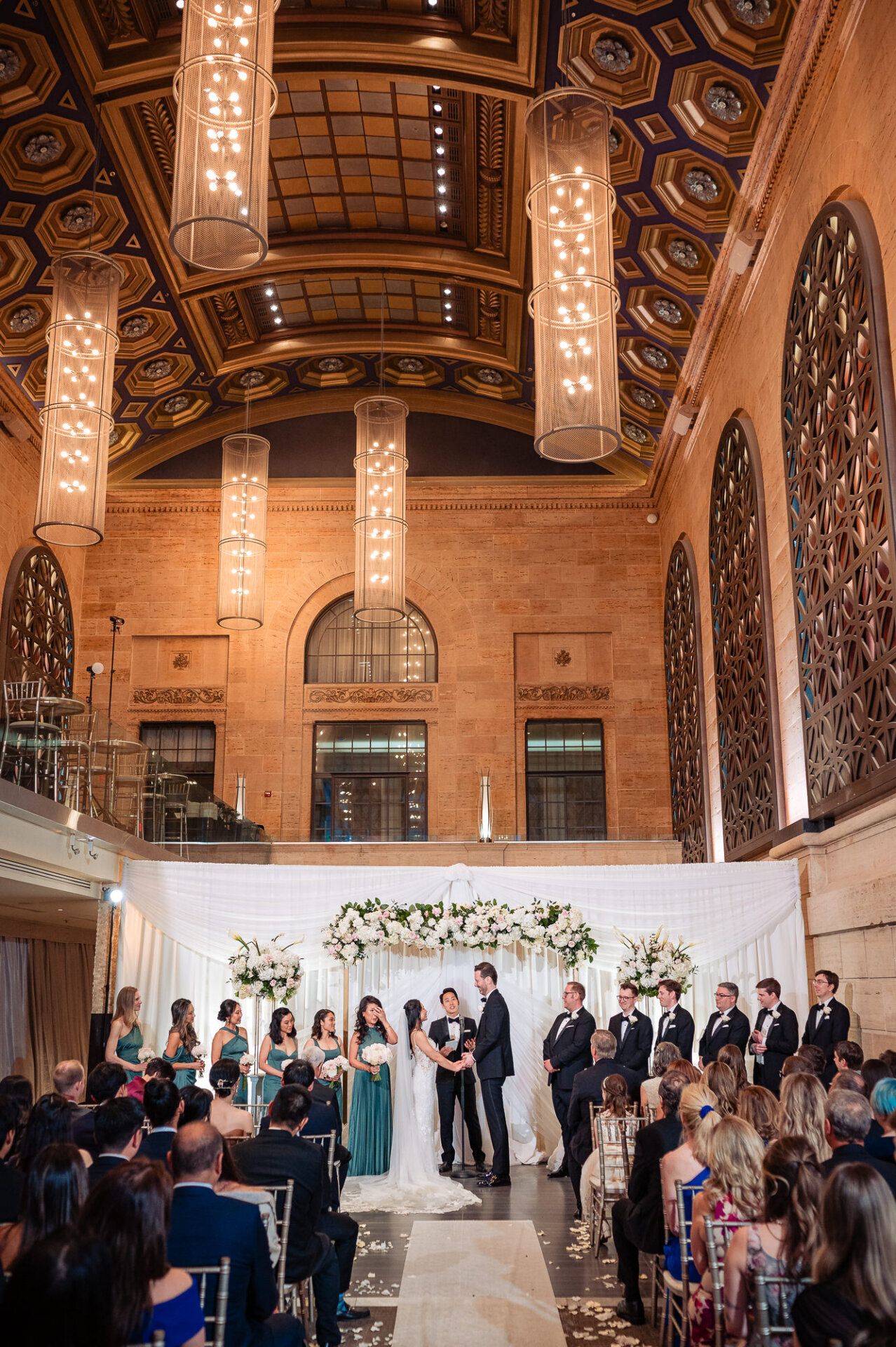 Union Trust wedding ceremony beneath soaring ceilings and dramatic architectural details