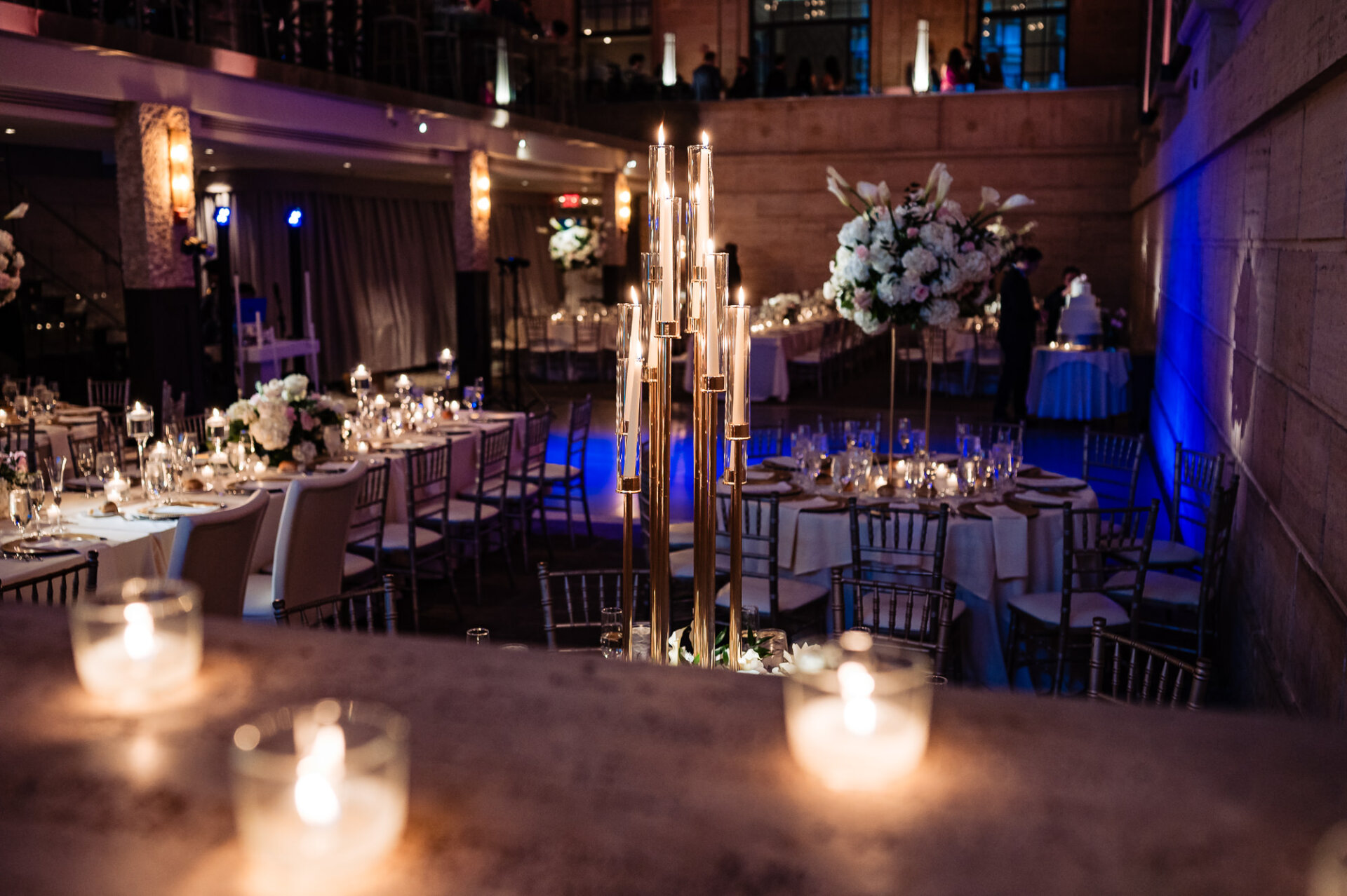 Romantic candlelit reception décor with elegant tablescapes and ambient lighting