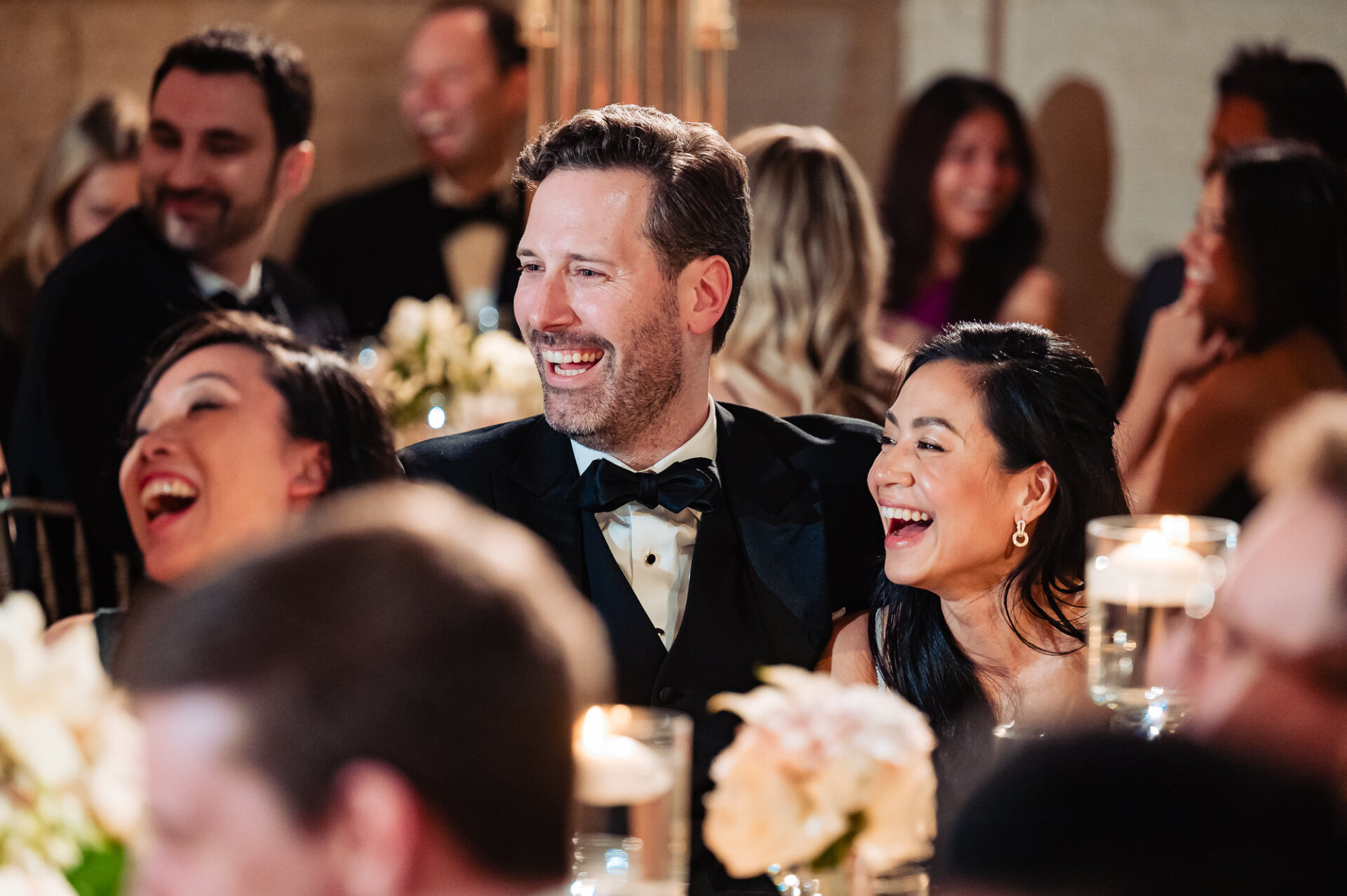 Kim and Greg share a joyful reaction during heartfelt wedding reception speeches