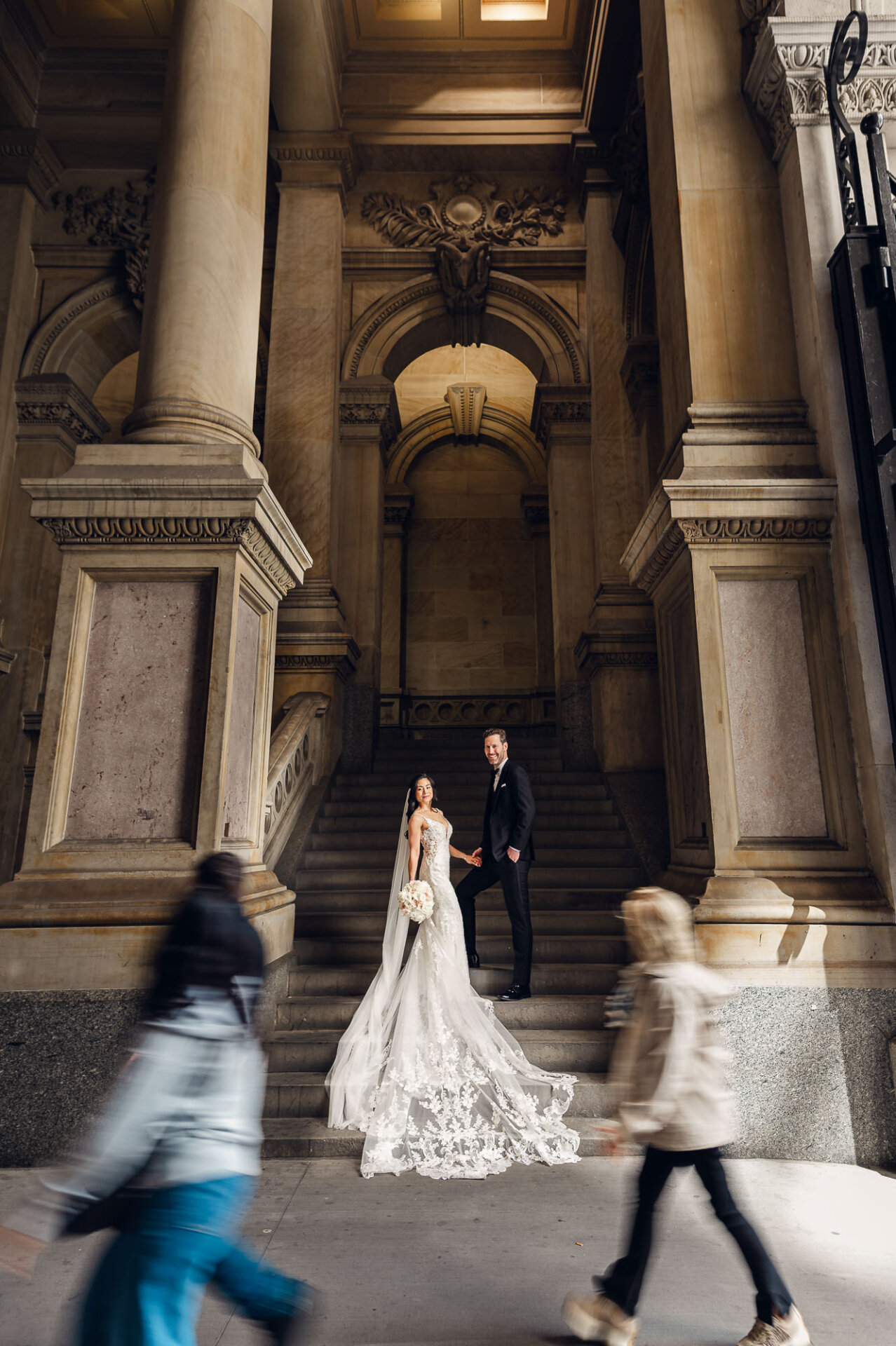 Editorial wedding portrait on the staircase showcasing Union Trust’s historic architecture
