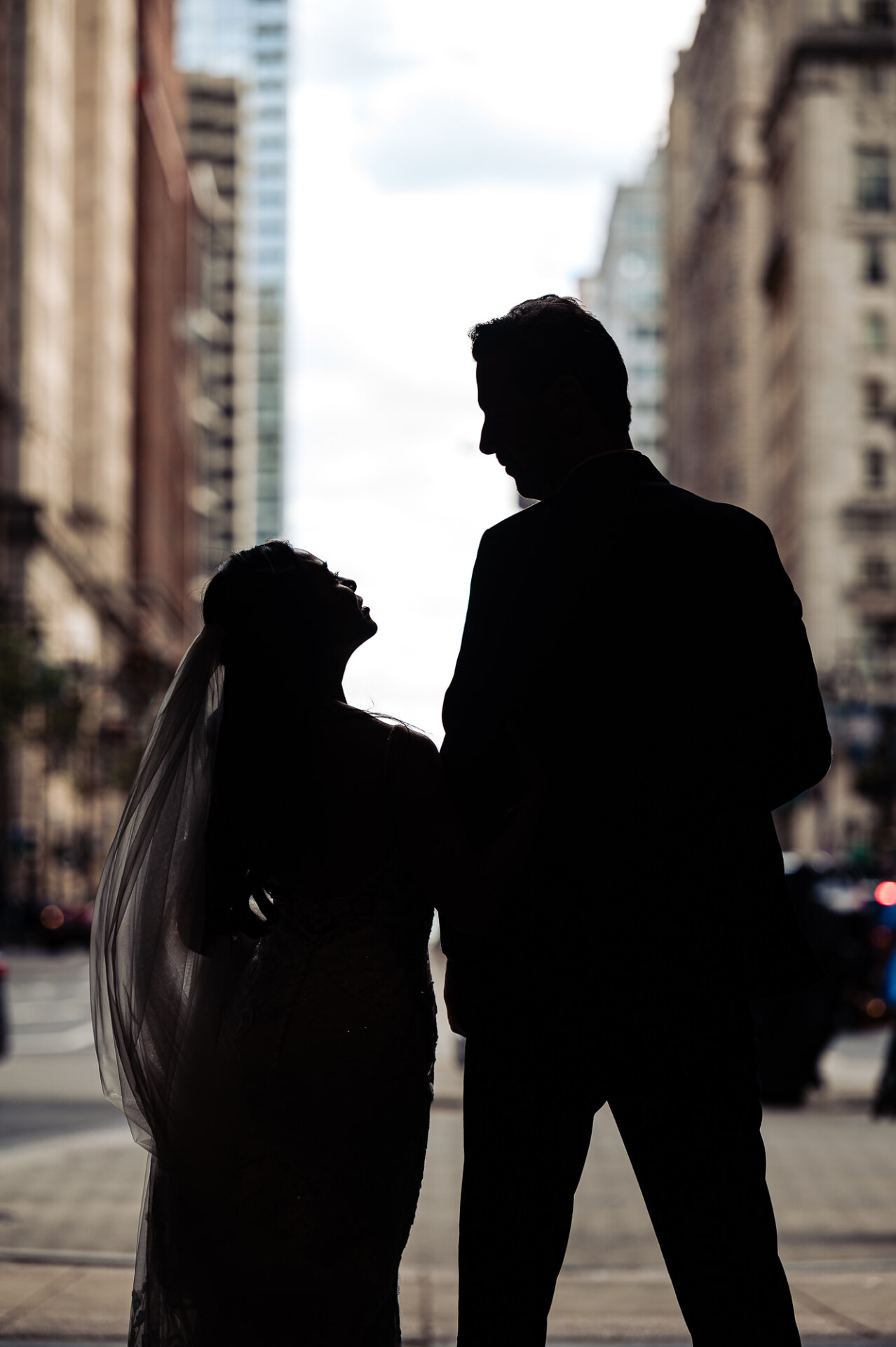 Silhouette wedding portrait of Kim and Greg framed by Philadelphia’s city streets