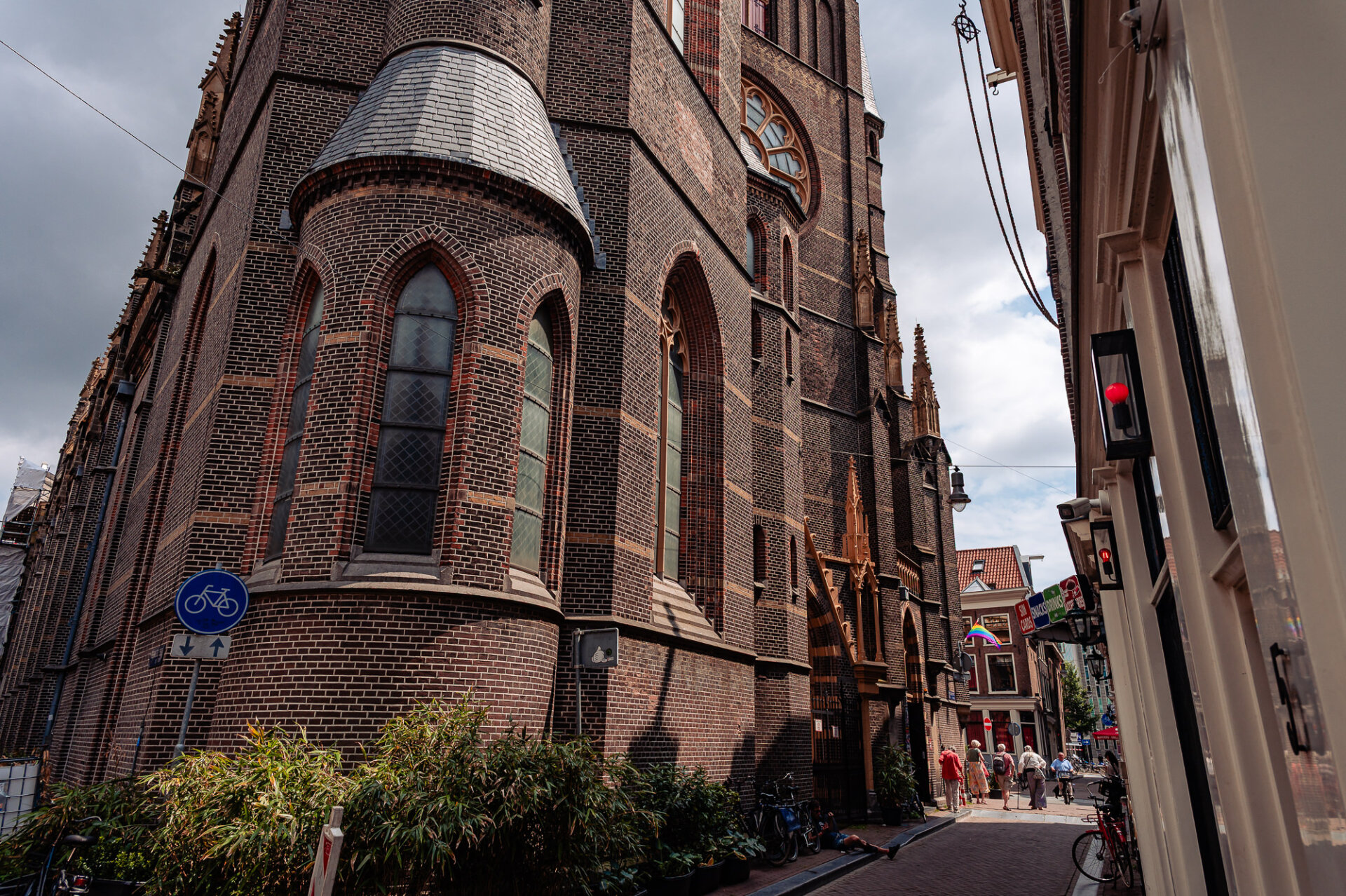 Historic brick church beside a narrow street in Amsterdam’s Red Light District