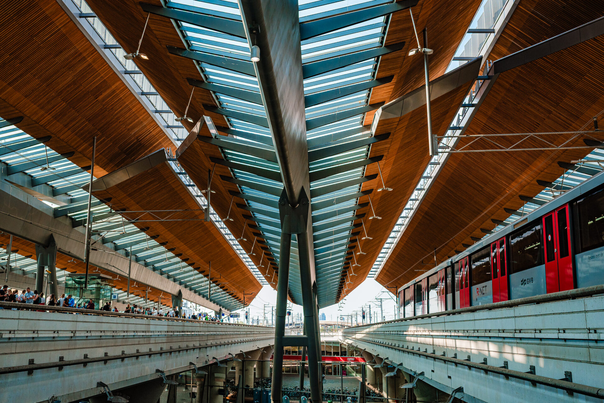 Modern train platforms and striking wood-and-glass architecture at Amsterdam Centraal Station