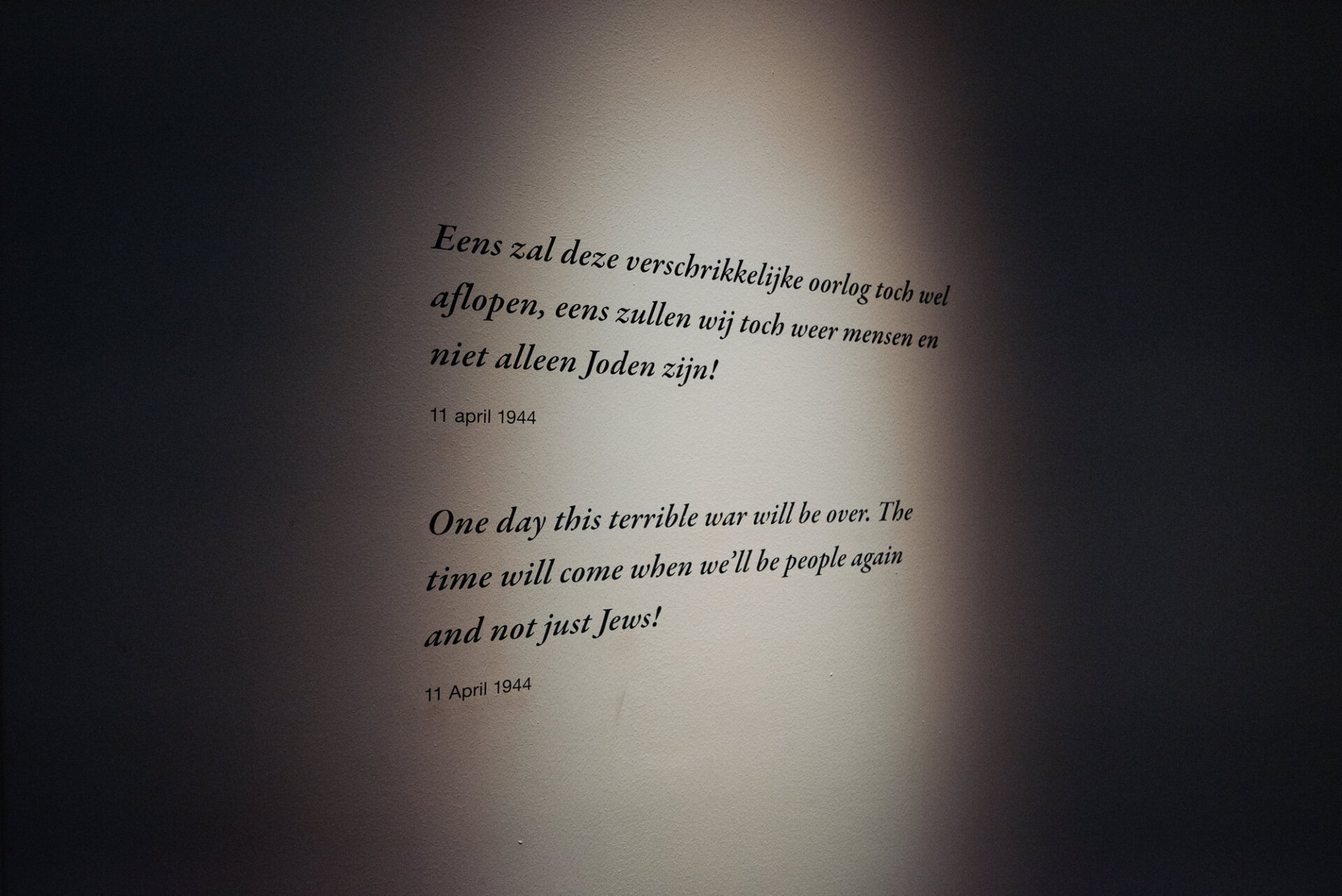 Anne Frank quote dated 11 April 1944 displayed on a museum wall in Amsterdam