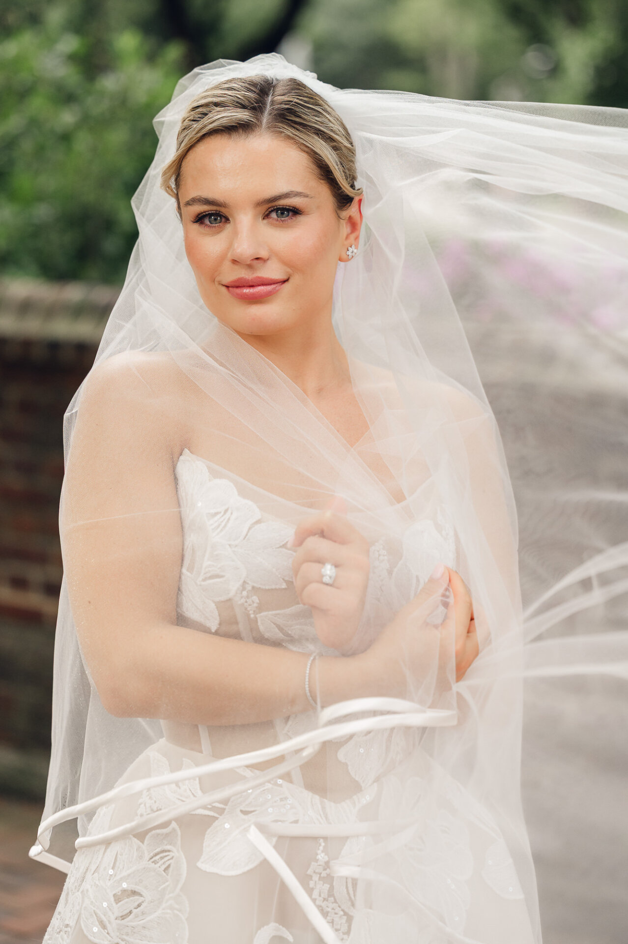 Close-up bridal portrait framed by a sheer veil during a wedding in Philadelphia.