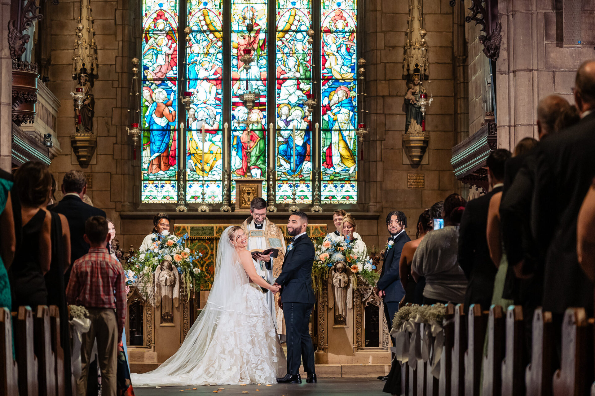 Bride and groom smiling at the altar during their Philadelphia wedding ceremony.