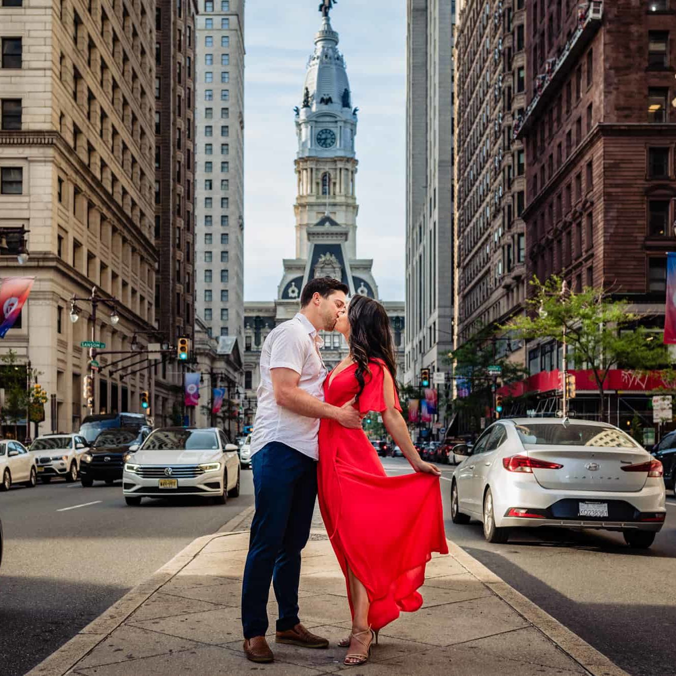 long shot of the couple kissing outside at their philly art museum e-session